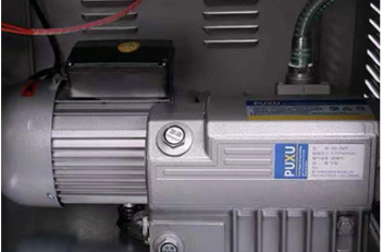 Industrial-grade PUXU vacuum pump inside the chamber vacuum sealer machine
