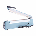 Impulse hand press bag sealer with side cutter - full machine white background studio shot